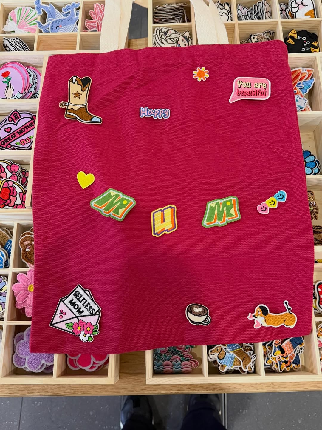 A tote covered in patches, each one picked and placed by hand. This is what slow making looks like.